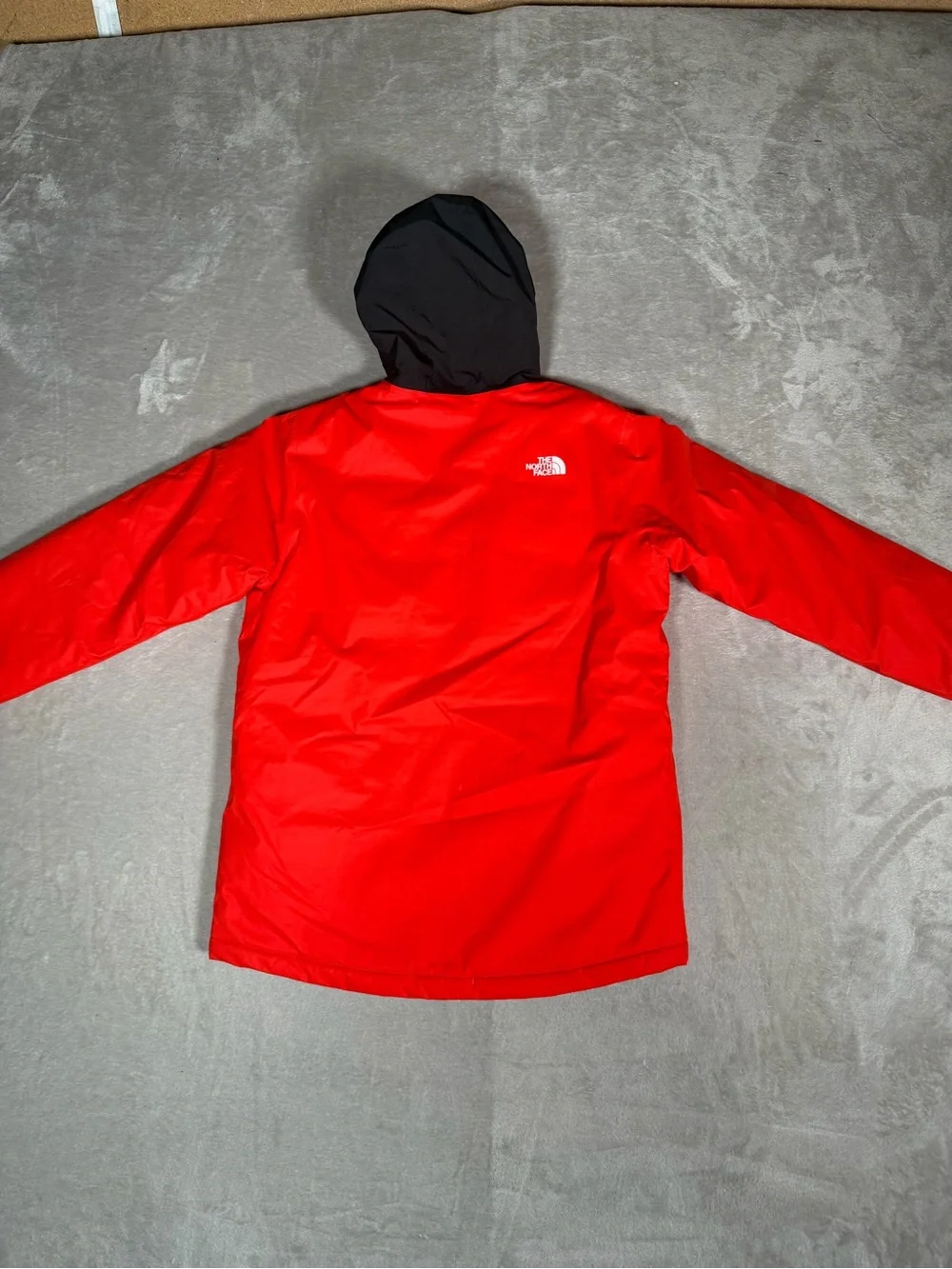 The North Face Red and Black Hooded Raincoat with Patterned Lining